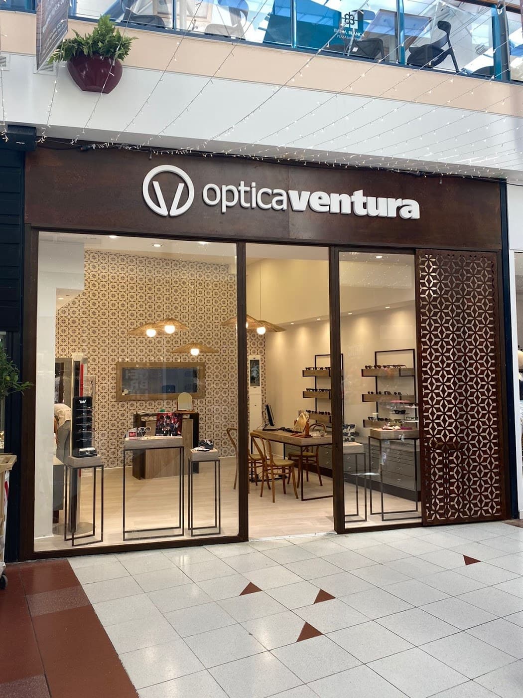 Optica Ventura Lens logo